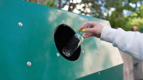 Reusable water bottles displayed in a hotel promoting sustainable tourism in Mauritius